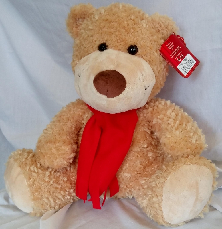 teddy bear with red scarf